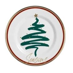 a white plate with a green christmas tree on it