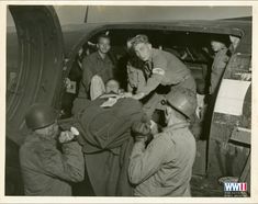 Official Signal Corps photograph of a Private First Class James Lovelace being loaded into a Douglas C-47 Skytrain by Army medics at the 3rd US Army Air Evac Holding Station. This photograph was taken in September 1944 in Toul, France. Selected from The Allan Voluck Collection 2015 at The National WWII Museum. 7th Infantry Division, Magazine Street New Orleans, Army Medic, Fort Benning, Military Decor, Warrant Officer, Military Training, Us Soldiers