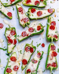 several green peppers topped with cheese and pepperoni