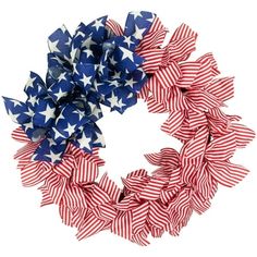 an american flag wreath with red, white and blue stars on the front is shown