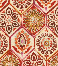 an orange and red rug with many different designs on it