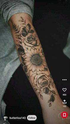 a woman with a sunflower tattoo on her arm