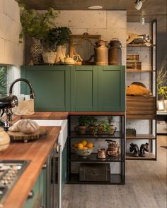 the instagram page shows an image of a kitchen with green cabinets and wooden counter tops