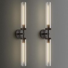 two lights that are on the wall next to each other