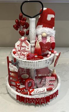 a valentine's day gift tower with santa hat on top