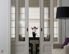 a living room filled with furniture and white walls