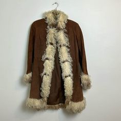 In good vintage condition, minor wear due to age  Penny lane afghan coat  60s/70s  Size 7/8-- fits like an XS Vintage Long Outerwear For Fall, Fitted Vintage Brown Winter Outerwear, Fitted Vintage Brown Outerwear For Winter, 1970s Fitted Winter Outerwear, Vintage Brown Winter Outerwear, Vintage Long Fur Coat For Fall, Retro Long Winter Outerwear, Afghan Coat, Coats Vintage