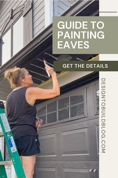 a woman painting the side of a garage door