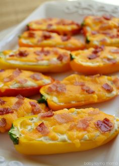 several stuffed peppers with cheese and bacon on them