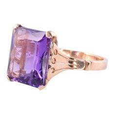 This is part of Chairish’s Fine Jewelry assortment.  Vintage retro approximately 7.50 carats amethyst ring, circa 1940. This 18 karat retro square cut amethyst ring is size 9.5.  Exact dimensions for this item are unknown.  Please reference the measurements noted in the description above for the best approximate dimensions. Please reach out to the seller under "Ask the Seller" for specific questions regarding the measurements.  *Resizing available for additional charge. Elegant Rectangular Amethyst Ring For Formal Occasions, Square Cut Amethyst Ring For Formal Occasions, Formal Square Cut Amethyst Ring, Classic Amethyst Ring With Rectangular Stone For Formal Occasions, Yellow Gold Amethyst Ring With Rectangular Shape, Rectangular Amethyst Ring In 14k Gold, Elegant 14k Gold Rectangular Amethyst Ring, Classic Purple Square Cut Ring, Classic Yellow Gold Rectangular Amethyst Ring