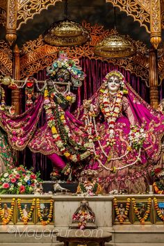 an elaborately decorated shrine with statues and decorations