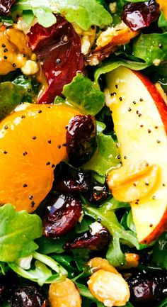 a salad with oranges, cherries and nuts