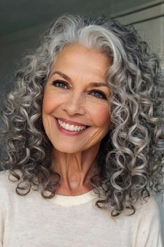 Grey Hair Color Curly, Spiral Perm Gray Hair, Medium Length Curly Gray Hair, Long Wavy Gray Hair Over 50, Grey Hair Perms, Perms For Gray Hair Over 50, Permed Grey Hair Older Women, Grey Blending Curly Hair, Silver Curly Hair Natural Curls