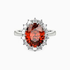 an orange and white diamond ring on a white background