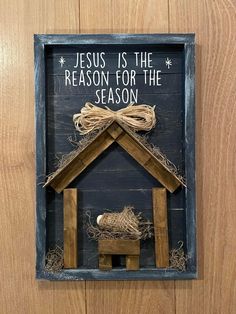 a nativity scene made out of wood and rope with the words jesus is the reason for the season