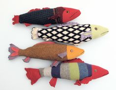 three knitted fish sitting on top of each other