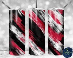 two red and black cans with straws in them on a white background, one is empty