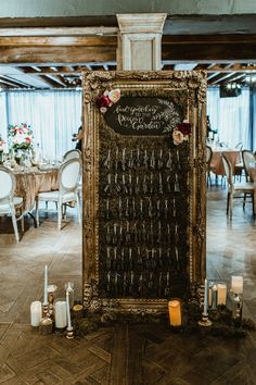 a table with candles and wine glasses on it in front of a sign that says welcome to our guests