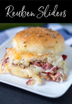 a close up of a sandwich on a plate with the words reuben sliders above it