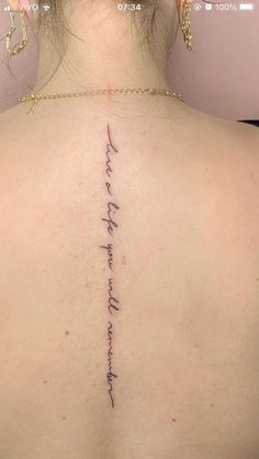 the back of a woman's neck with her handwriting on it