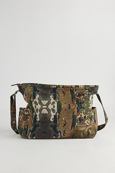 Printed patchwork & camo pattern shoulder bag with utility style pockets. Bag features a main zip compartment and adjustable shoulder strap. Features Camo patch shoulder bag Printed patchwork pattern bag Utility pockets Zip top closure Adjustable strap Content + Care 100% Cotton Spot clean Imported | Camo Patch Shoulder Bag in Assorted, Men's at Urban Outfitters Military Style Outdoor Bags With Pockets, Military Style Bags With Pockets For Everyday Use, Military Style Satchel Bag For Everyday Use, Military Style Everyday Bag With Pockets, Military Style Satchel For Everyday Use, Military Travel Bag With Pockets, Utility Bags With Functional Pockets Rectangular, Utility Bags With Functional Pockets, Utility Bags With Functional Pockets And Rectangular Shape