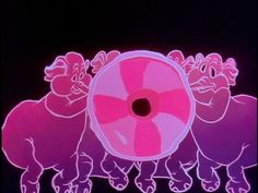 three pink pigs are standing in front of a round object that looks like a candy cane