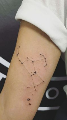 a woman's arm with a star tattoo on it