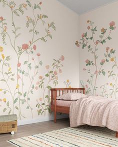 a bedroom with flowers painted on the wall