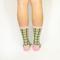 Tulip Grid Crew Socks Say hello to the all time favorite color combo!Bold green grid pattern with contrasting pink accents on sheer mesh. One Size fits most. Up to size 10 USHand washKeep away from sharp stuff! Trendy Green Socks For Spring, Pink Stretch Socks For Summer, Stretch Pink Socks For Summer, Trendy Fitted Green Socks, Stretch Green Summer Socks, Stretch Green Socks For Summer, Spring Fishnet Socks, Green Grid, Mesh Socks