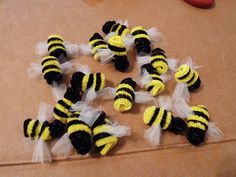 small yellow and black bees with tulle