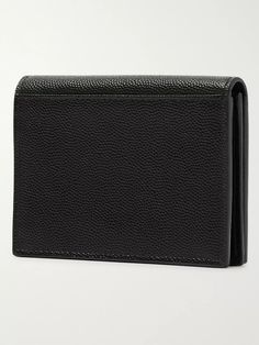 A sleek yet hardy design, SAINT LAURENT's pebble-grain leather wallet will mask any scratches or signs of daily use. Secured by a push-stud fastening, it has three card slots, one of which is big enough to store receipts or spare cash. Store Receipts, Saint Laurent Collection, Leather Billfold, Wallet For Men, Clip Cards, Billfold Wallet, Monogrammed Leather, Monogram Logo, Card Holder Leather