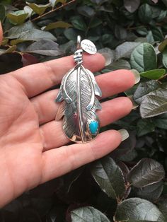 Native American sterling silver and turquoise pendant. This is a stunner for sure. Beautiful piece with great detail. This would be a great addition to your jewelry wardrobe. This is by artist Albert Platero... the last picture shows all the feather pendants I have for sale. You are only buying one feather. 14.03 grams Turquoise Feather Jewelry As Gift, Turquoise Feather Jewelry As A Gift, Silver Feather Pendant Jewelry, Enameled Jewelry, Herkimer Diamond Ring, Jewelry Wardrobe, The Last Picture Show, Feather Jewelry, Rainbow Moonstone Ring