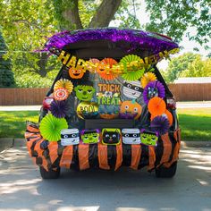 an orange and black car with decorations on it