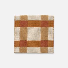 an orange and white checkered dish cloth