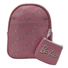 a pink bag and wallet with the word barbie on it