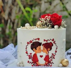 a wedding cake decorated with flowers and hearts