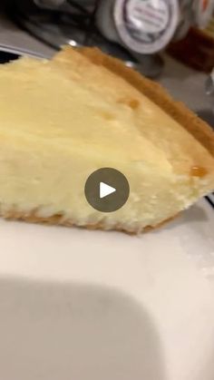 a piece of cheesecake sitting on top of a white plate