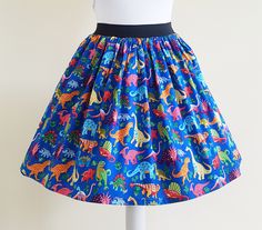 Dinosaurs Skirt Gathered  full skirt made from a beautiful 100% cotton, dinosaur fabric. Each skirt is made by gathering the fabric onto  a 2 inch black elastic waistband. The length measures from the top of the waistband and comes in three lengths, 19", 22" or 25". Please choose length from the drop down menu. The waist measurement can be seen in the measurement guide below. Please choose waist size from the drop down menu. The skirt is pictured with a petticoat to show its potential fullness, Dinosaur Skirt, Rockabilly Skirt, Dinosaur Fabric, Quirky Fashion, Waist Measurement, Gathered Skirt, Full Skirt, Petticoat, Waist Size