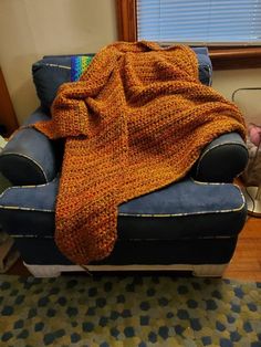 a couch with a blanket on top of it