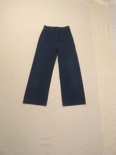 "1970s Levis jeans high waist TALON 42 zipper  orange tab no pockets (decorative welt flap) 5 skinny belt loops button waist and decorative flap button have distressed patina wide leg hip hugging good vintage condition, light wear cotton denim feel medium dark wash, nice authentic age wear labeled size n/a, see below measures, lying flat, waist-13 1/2\" rise-12 1/2\" inseam-28 1/2\" hem-10\" hip-19\" outseam-40\"     We do not offer returns or refunds unless something is grossly misrepresented. Please contact us within 2 business days of receiving to discuss any possible returns for this reason. We do not offer refunds for your shipping fees. Please feel free to contact us with any questions you may have about an item prior to purchase and we will gladly answer them." Vintage High Waist Pants With Five Pockets, Wide Leg Retro Jeans, Vintage Wide Leg Denim Pants, Vintage High Waist Medium Wash Flare Jeans, Vintage High Waist Denim Flare Jeans, Vintage High Waist Cotton Flare Jeans, Retro High Waist Jeans With Belt Loops, Vintage Wide Leg Flare Jeans With Five Pockets, Vintage Wide Leg Denim Blue Jeans