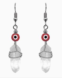 Evil Eye Bead Wire Wrapped Quartz Crystal Dangle Earrings Round evil eye bead earrings with a silver metal wire wrapped clear quartz crystal point dangle. Surgical steel hooks are hypoallergenic and lightweight for a comfortable fit. Sold in assorted colors. Approximately 2 inches in length. Materials: Quartz Crystal, Evil Eye Bead, Metal Wire, Stainless Steel Handmade in Peru. Disclaimer: Each one of our products are handmade and unique, ASSORTED COLOR, AND/OR PATTERN variations of the product. White Wire Wrapped Dangle Crystal Earrings, Witchy Products, Round Evil Eye, Bead Wire, Wax Melters, Crystal Dangle Earrings, Earrings Round, Protection Necklace, Clear Quartz Crystal