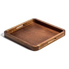 an empty wooden tray with handles on a white background