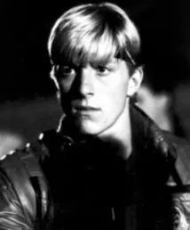 black and white photo of young man in leather jacket