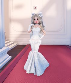 a doll dressed in white is standing on a red carpet