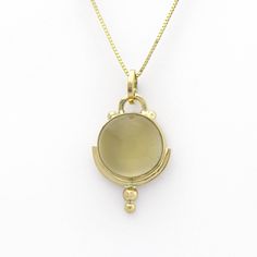 This lovely golden moonstone amulet is SASA's trademarked Art Deco style in a handmade 14K yellow gold setting. Little solid 'bubbles' of gold on the tip add sparkle when light falls upon them. According to Hindu mythology, moonstone is made of solidified moonbeams. Many other cultures also associate this gem with moonlight, and it's easy to see why. Its internal structure scatters the light that strikes it, creating a phenomenon known as adularescence. The visual effect is reminiscent of the fu Yellow Gold Chalcedony Jewelry Gift, Formal Yellow Gold Chalcedony Jewelry, Yellow Gold Moonstone Jewelry, Unique Yellow Gold Moonstone Jewelry, Formal Yellow Gold Moonstone Jewelry, Yellow Gold Chalcedony Gemstone Necklace, Luxury Gold Moonstone Jewelry, Chalcedony Cabochon Yellow Gold Jewelry, Yellow Gold Chalcedony Jewelry With Cabochon