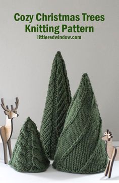 three knitted christmas trees sitting next to each other with the words cozy christmas trees knitting pattern