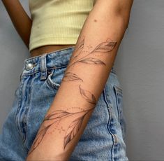 a woman with a tattoo on her arm