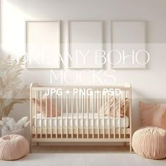 a white crib with pink pillows in front of three framed photos