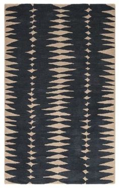 a black and white rug with an abstract design