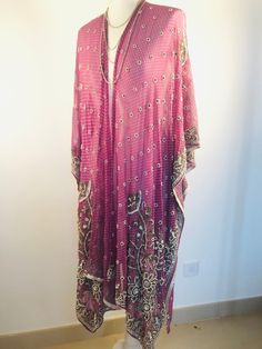 "A Unique and Truly Beautiful Kimono Jacket. This has been Handmade from a Vintage Indian Silk Sari.... so is completely Original and one of a kind. A Wonderfully Chic, flattering colour way of Dusky Lilac,Embellished with allover Beads and Sequins that Sparkle and catch the Light. The Gorgeous embroidery design has 1000's of Silver bugle beads , Pearly white beads and Glittering Crystals. This Stunning 3/4 length Jacket is made in Silk Chiffon ,so drapes elegantly ,with loose Waterfall sleeves Hippy Festival, Sequin Kimono, Chiffon Cardigan, Summer Cover Up, Beautiful Kimono, Beaded Jacket, Beautiful Kimonos, Boho Kimono, Hippie Festival